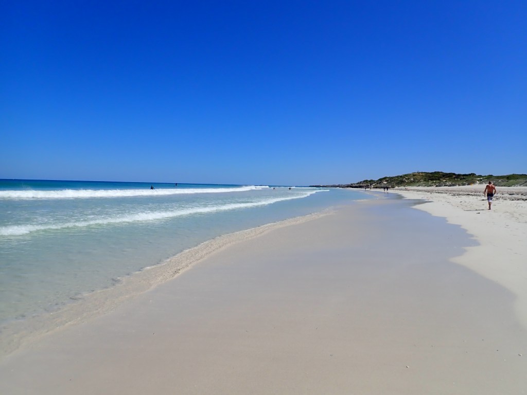 Scenic calm beach with white sand.